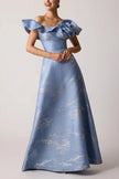 OFF SHOULDER JACQUARD RUFFLE GOWN WITH FLOWER APPLIQUE