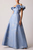 OFF SHOULDER JACQUARD RUFFLE GOWN WITH FLOWER APPLIQUE