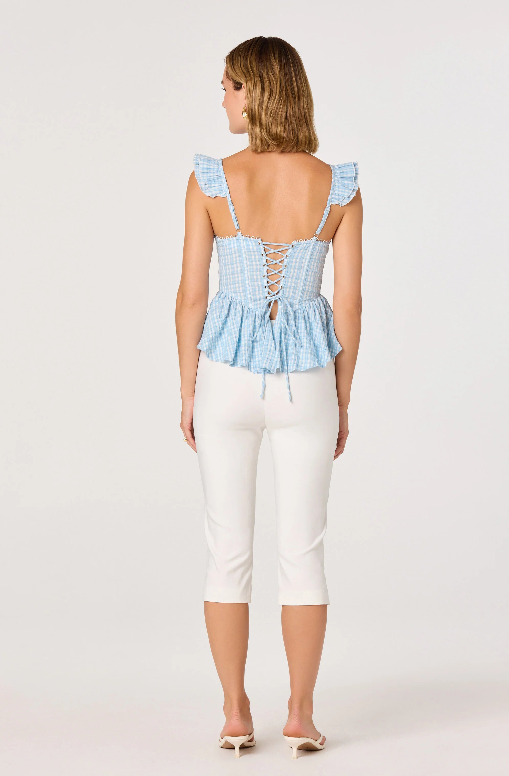 BAYLIN EYELET CORSET PEPLUM TOP IN BLUE PLAID