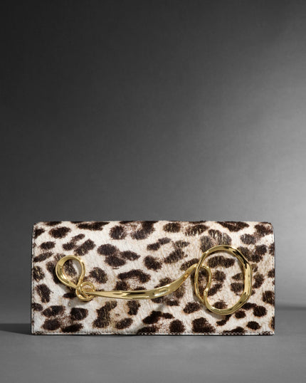 TWISTED GOLD SIDE HANDLE CLUTCH PURSE IN METALLIC LEOPARD