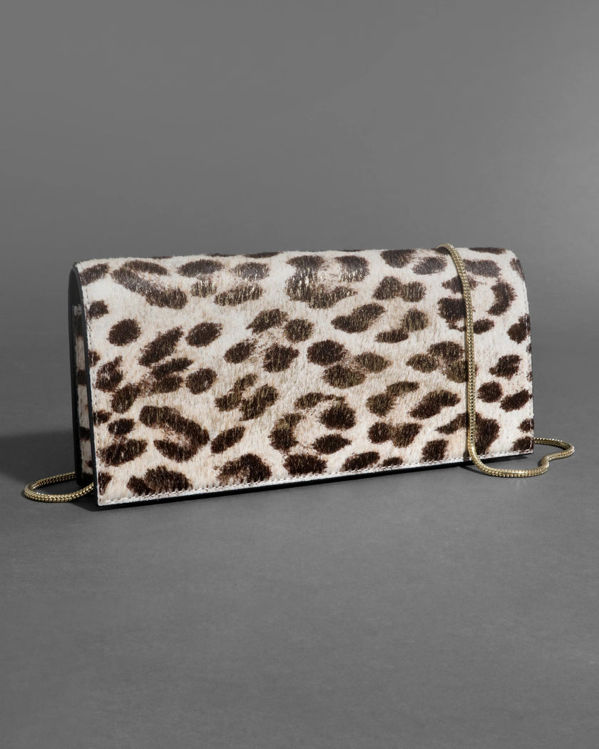 TWISTED GOLD SIDE HANDLE CLUTCH PURSE IN METALLIC LEOPARD