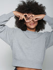 SWEATSHIRT WITH HEART CUT OUT AND BEADING